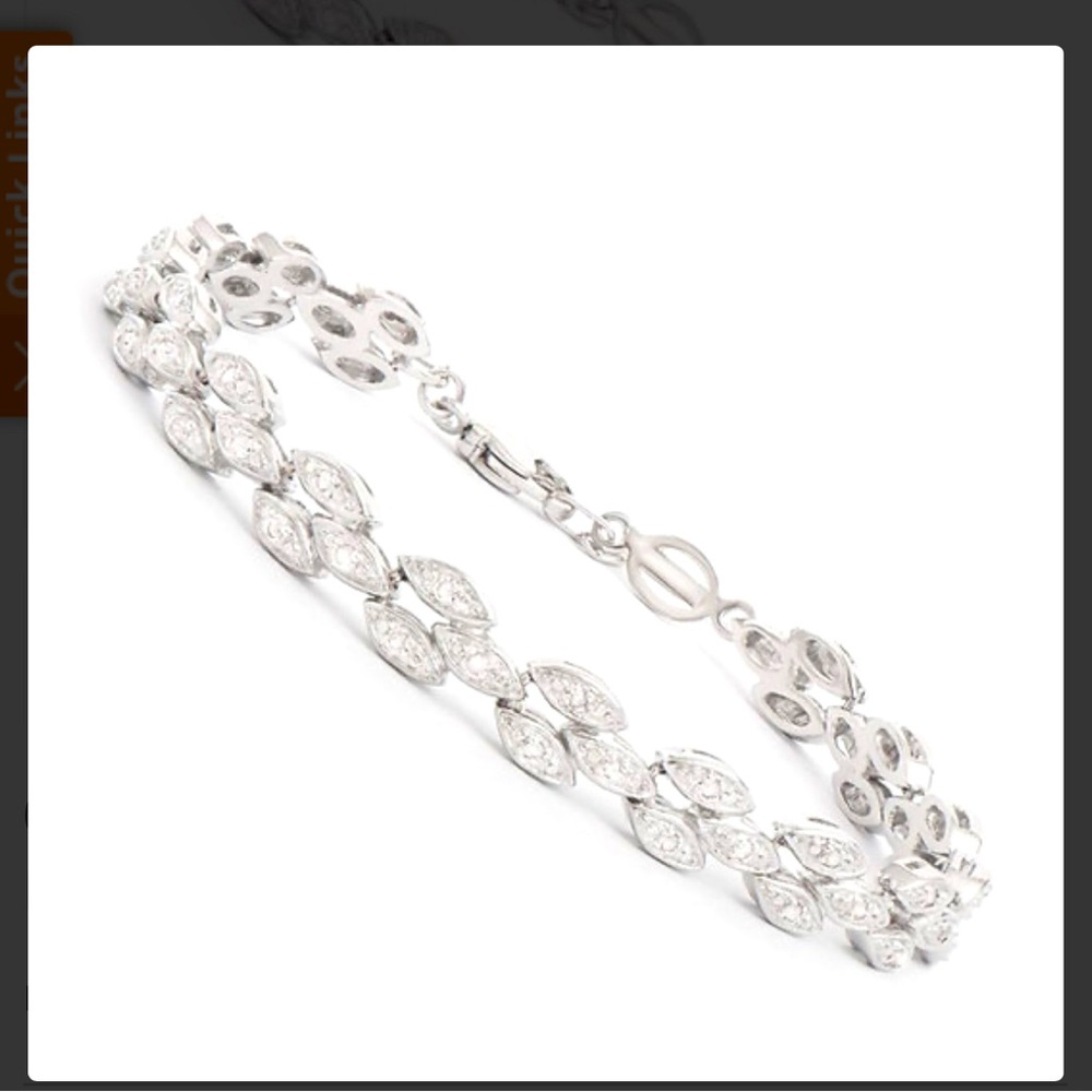 .2 central diamonds rhodium plated over gold